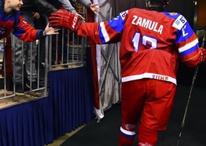 CHELYABINSK, RUSSIA - APRIL 24: Russia's Yegor Zamula #12 is greeted by fans as he heads to the dressing room following warm-up and prior to preliminary round action against Slovakia at the 2018 IIHF Ice Hockey U18 World Championship. (Photo by Andrea Cardin/HHOF-IIHF Images)

