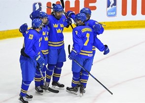 CHELYABINSK, RUSSIA - APRIL 29: Sweden's Marcus Westfalt #26 (centre) celebrates with teammates David Gustafsson #13, Nikola Pasic #22, Nils Lundkvist #7 and Oskar Back #11 after scoring on team Czech Republic during bronze medal game action at the 2018 IIHF Ice Hockey U18 World Championship. (Photo by Andrea Cardin/HHOF-IIHF Images)


